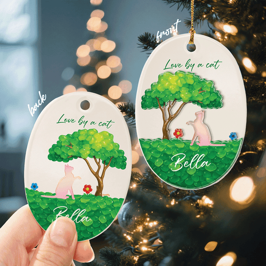 Front and back of the pink cat Love by a Cat oval ornament
