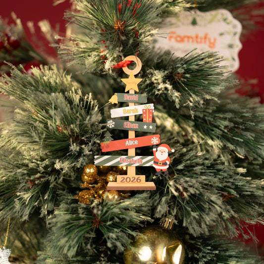 Family signpost wooden tree ornament on a flocked tree