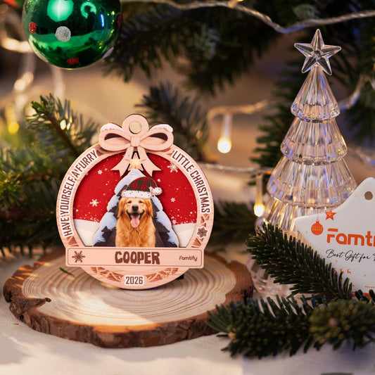 Furry Little Christmas pet ornament on a wood slice beside a Famtify tag