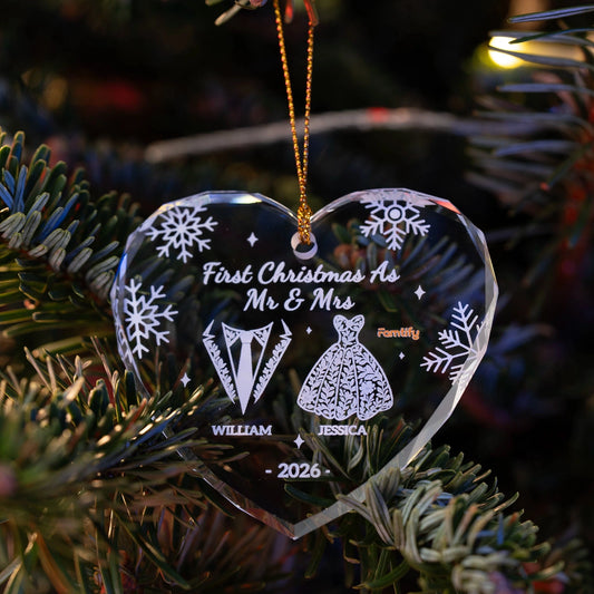 Mr and Mrs heart glass ornament hanging on a Christmas tree