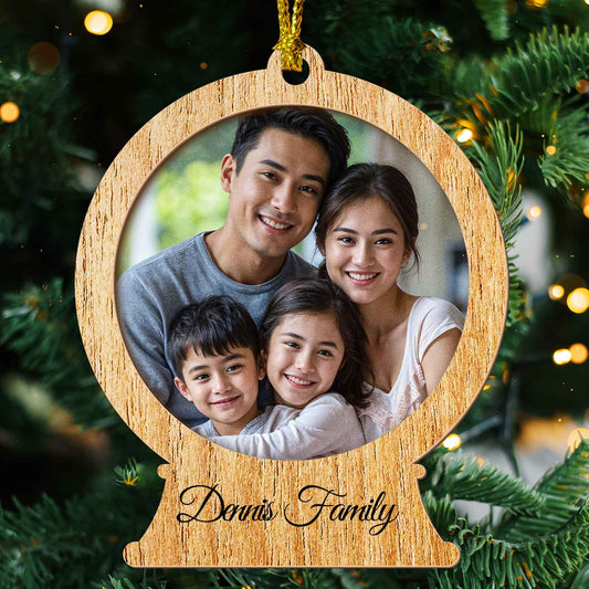 Two-layer wood snow globe ornament with a family photo and family name