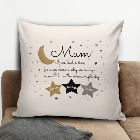 Personalized Mum star pillow with gold, black and grey stars holding custom children names on a brown couch