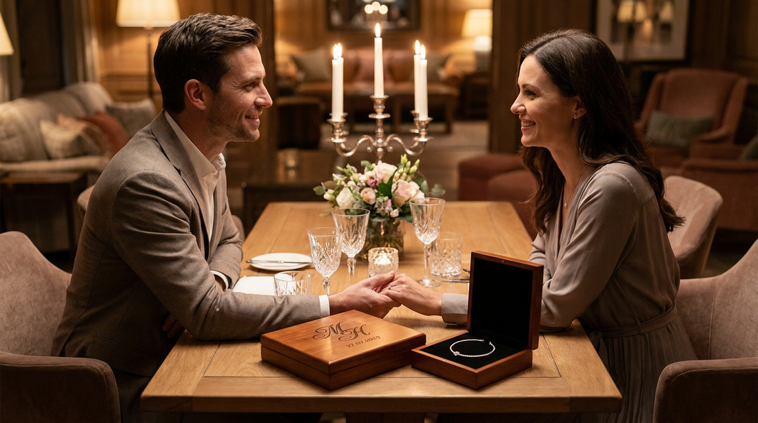 A newly engaged couple celebrating with a personalized keepsake on a table