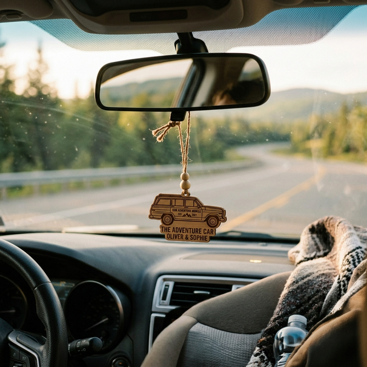 Personalized wooden car ornament charm hanging from a rearview mirror