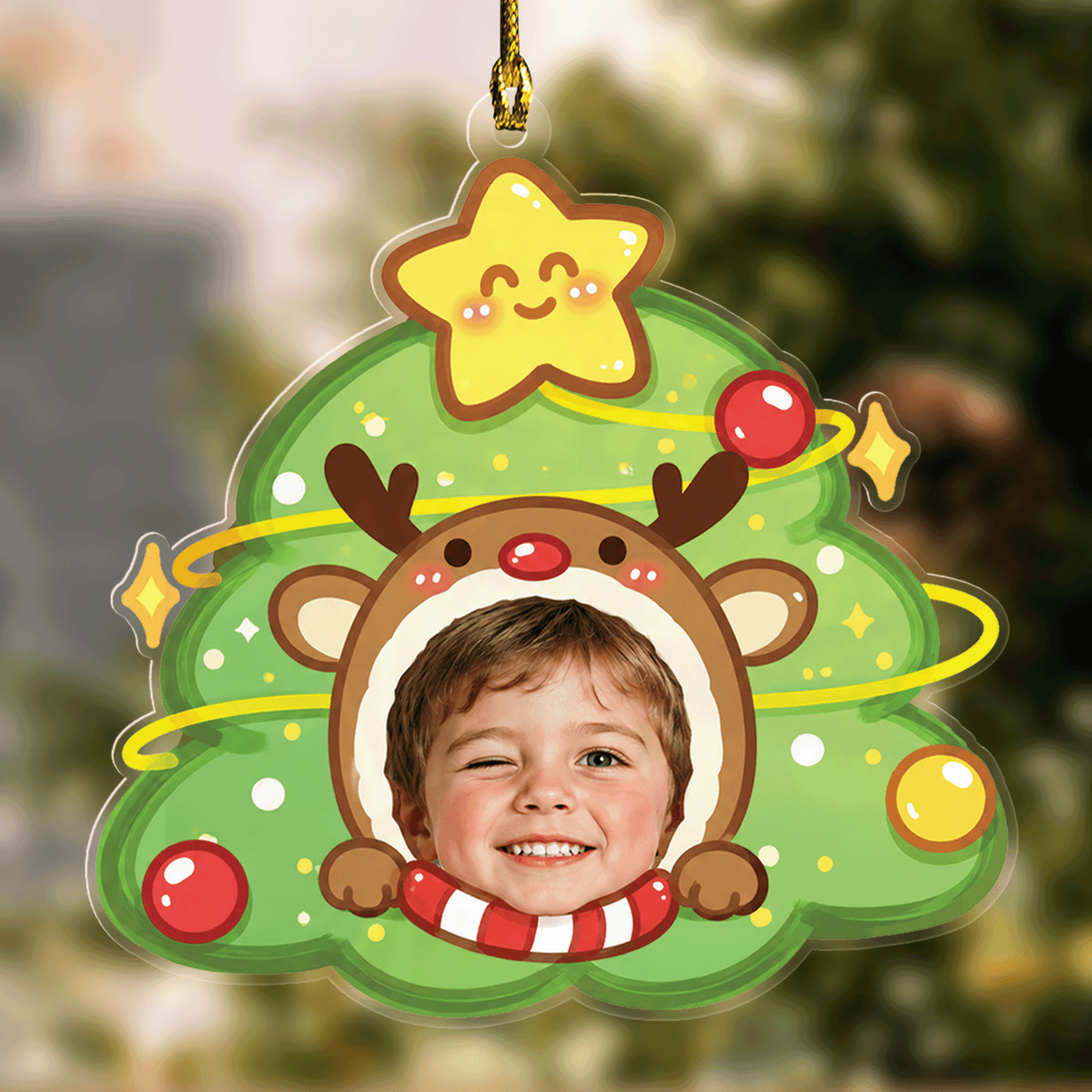 Acrylic Christmas tree ornament with a smiling star topper and a child's face in a reindeer hood with candy cane scarf