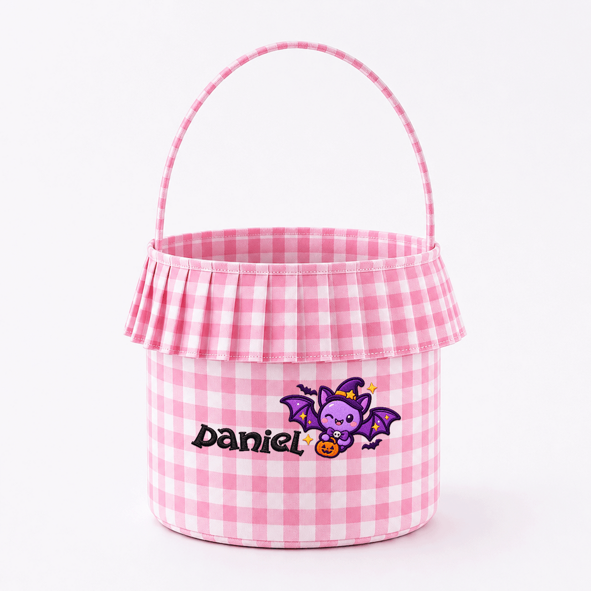 Pink gingham ruffle basket with 3D puff purple bat in a witch hat and custom name on a plain white background