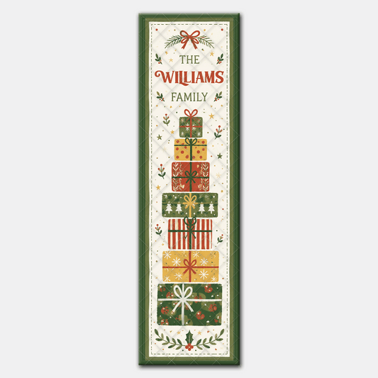 Full length stacked present runner design with red bow, family name and tower of wrapped gifts above holly