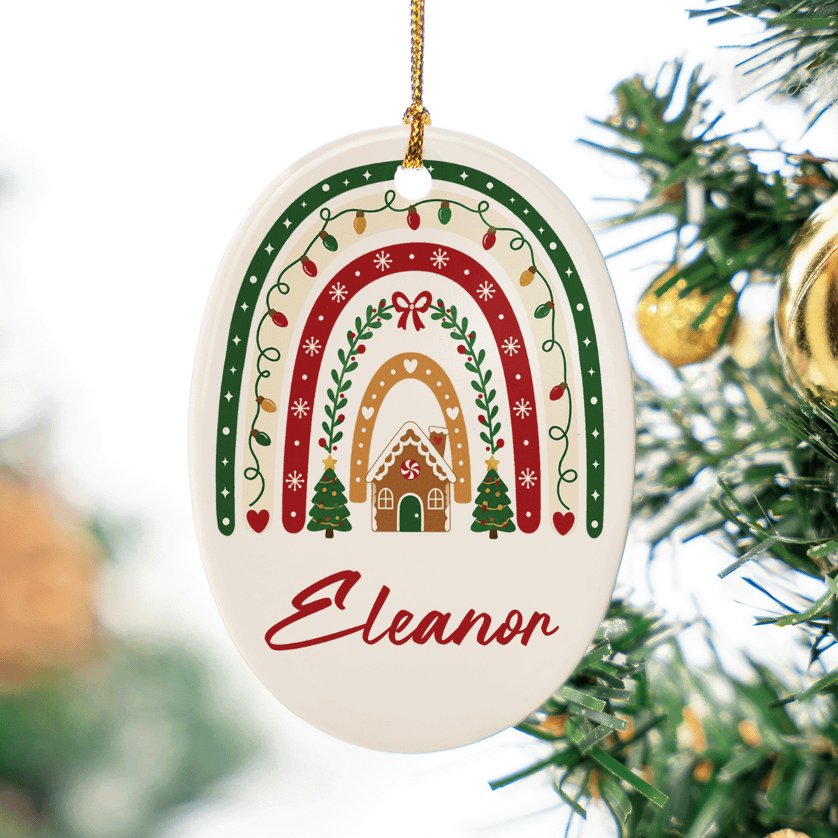 Close up of the Christmas rainbow gingerbread house ceramic ornament with custom name