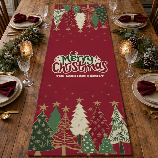 Red table runner with Merry Christmas and custom family name framed by rows of patterned green, cream and red Christmas trees