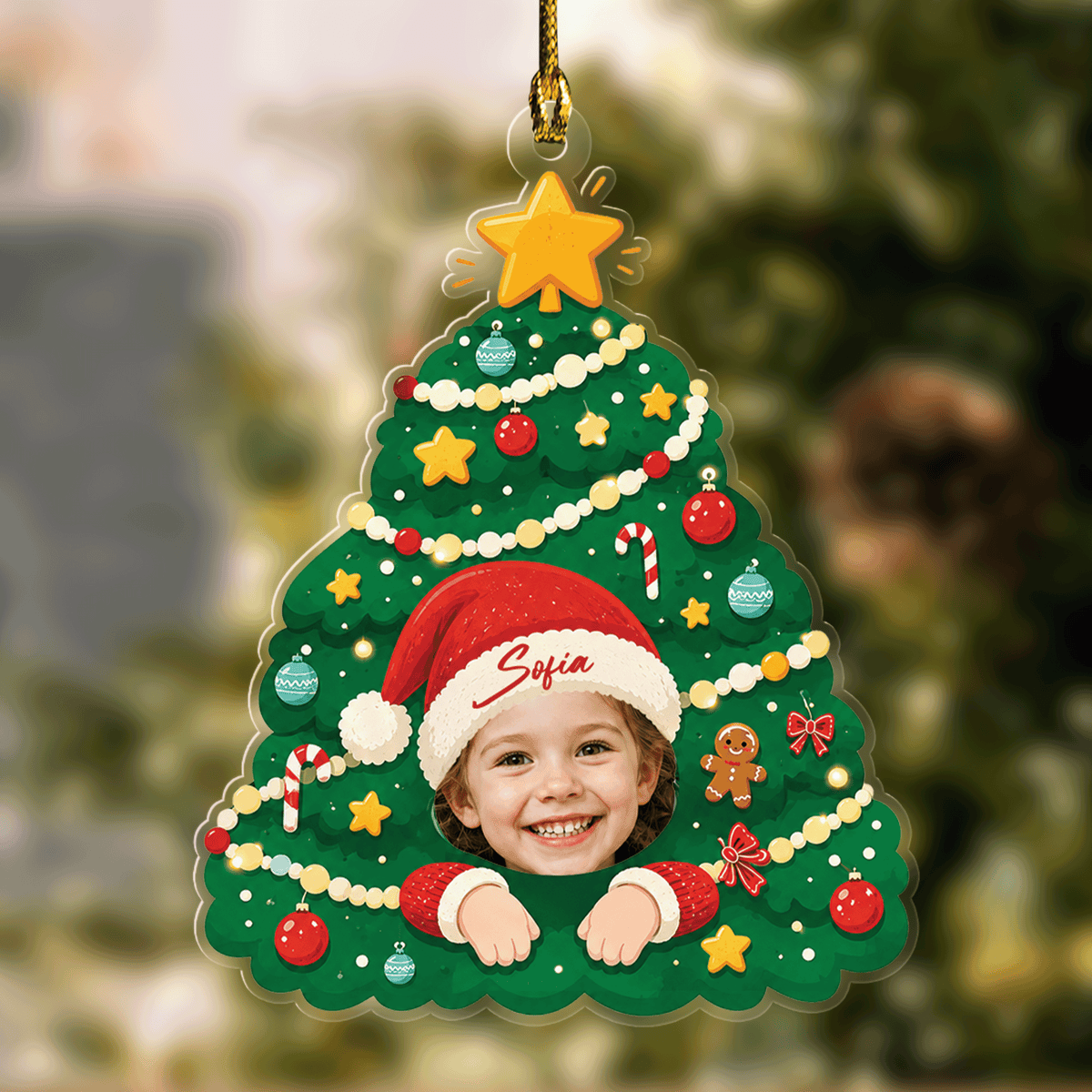 Christmas tree photo ornament with star topper, garland and a child's face in a named Santa hat