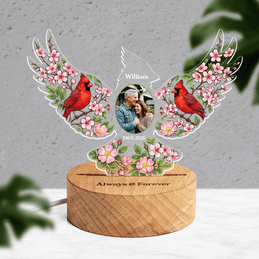 Front view of acrylic cardinal memorial lamp with custom photo, name and dates on a round wooden base