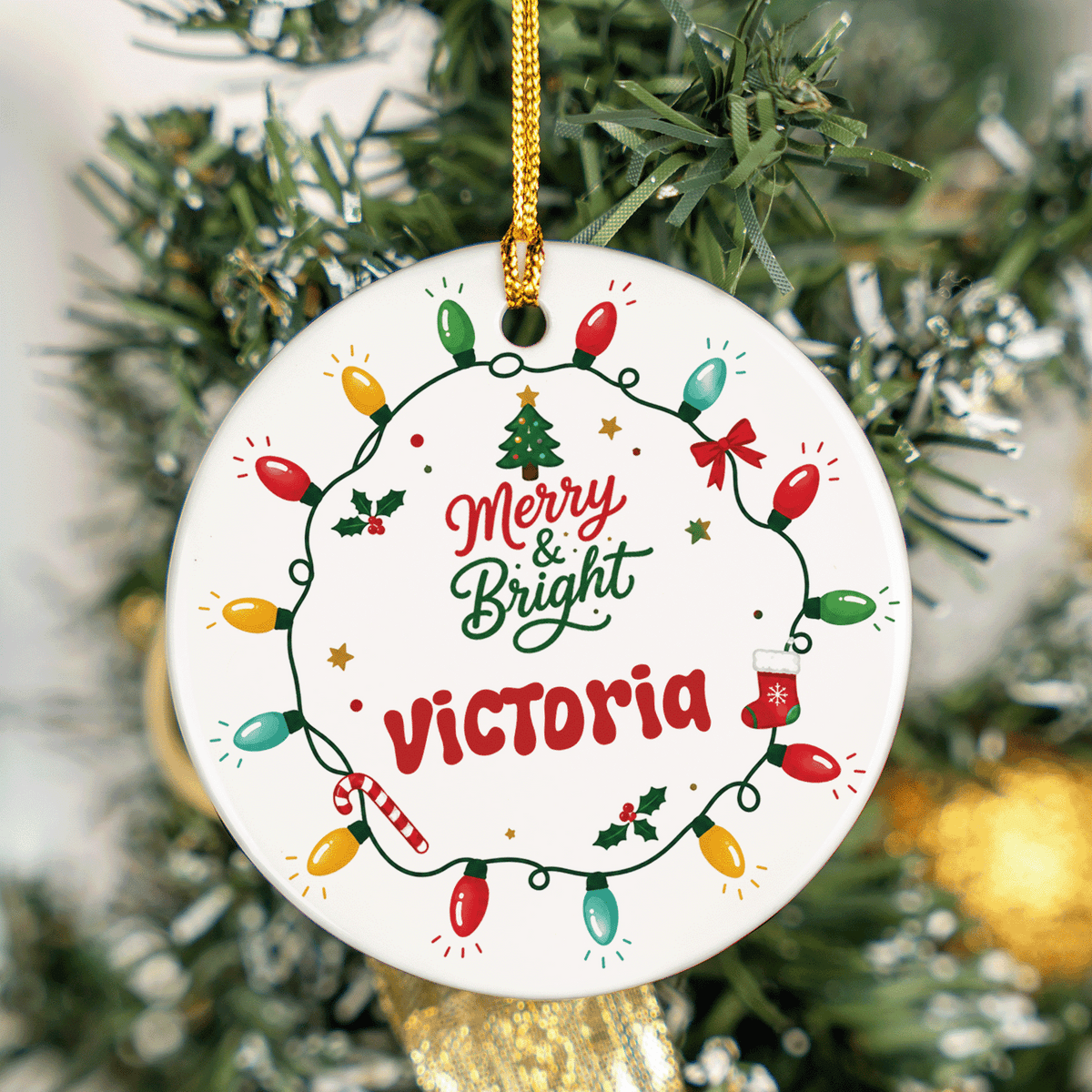 Merry and Bright custom name ornament hanging on a green tinsel tree
