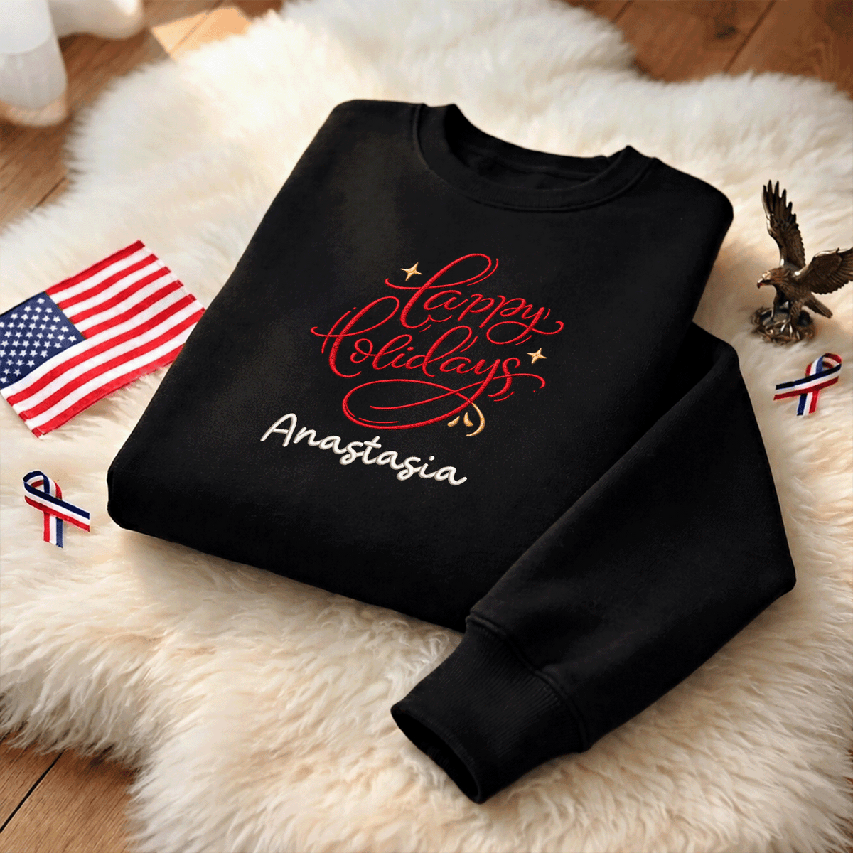 Black red Happy Holidays sweatshirt on a fur rug with a small flag and eagle