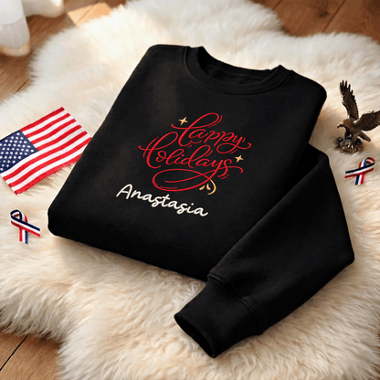 Black red Happy Holidays sweatshirt on a fur rug with a small flag and eagle