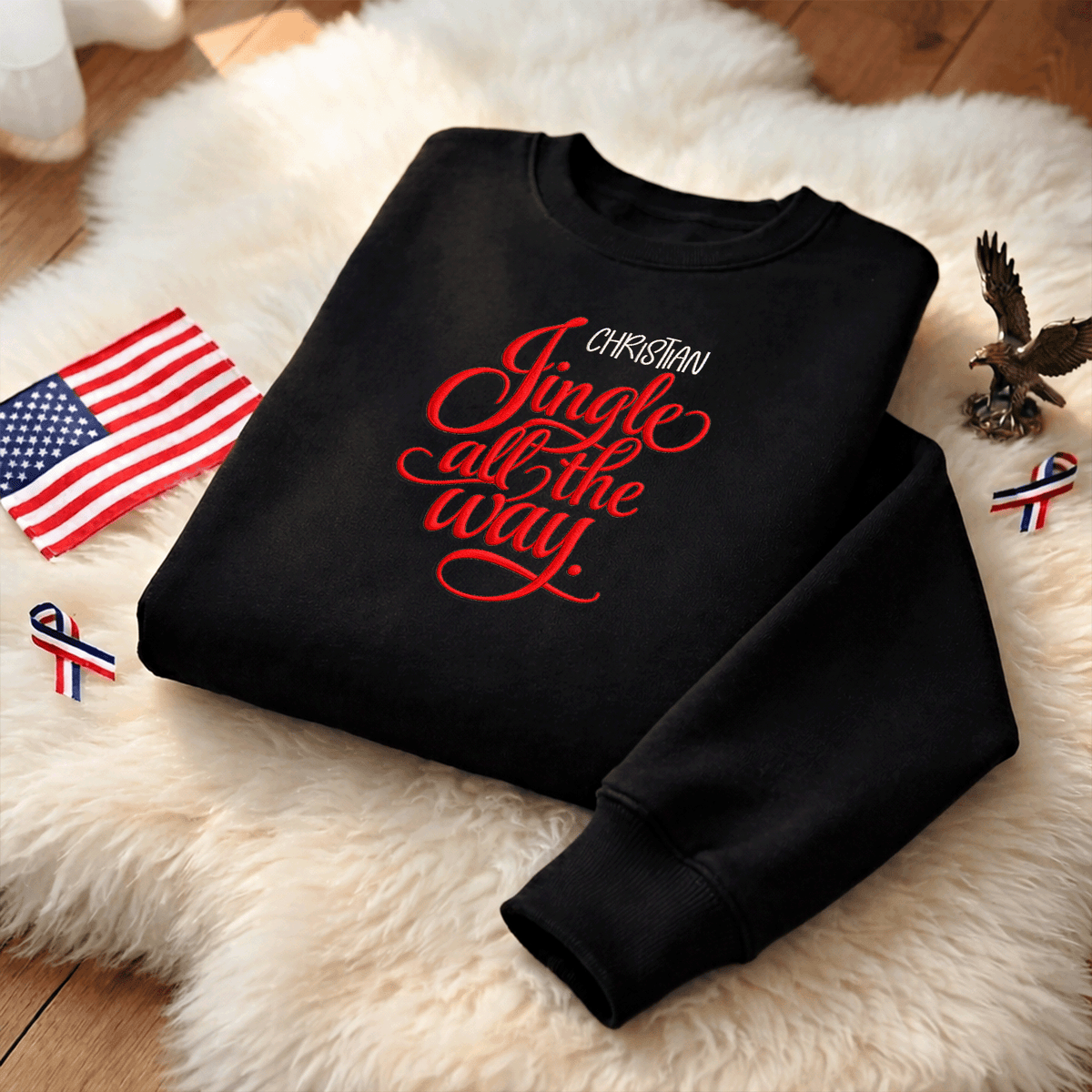 Black Jingle All the Way sweatshirt on a fur rug with a small flag and eagle