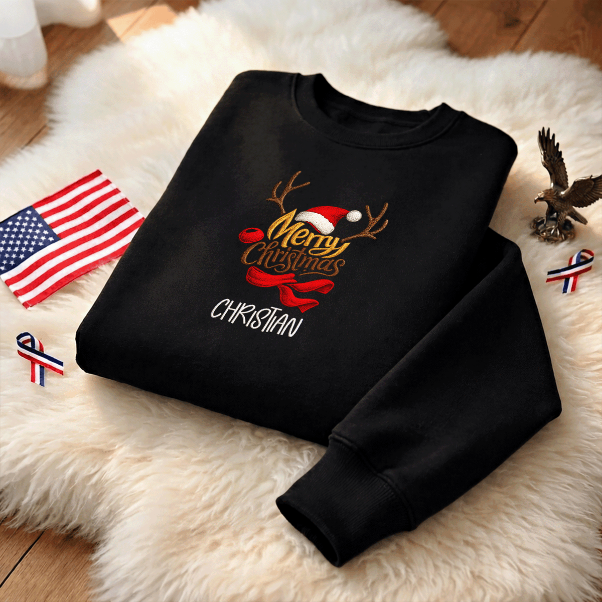 Black Merry Christmas reindeer sweatshirt on a fur rug with a small flag and eagle