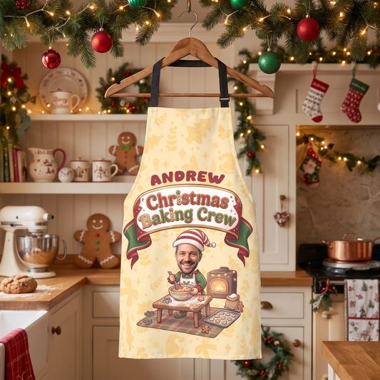 Yellow Christmas Baking Crew custom face apron on a hanger in a gingerbread decorated kitchen