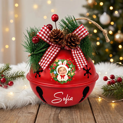 Personalized bunny wreath kid photo jingle bell ornament on a festive table