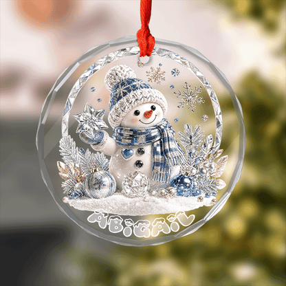 Round clear glass ornament printed with a crystal snowman holding a star and a custom name