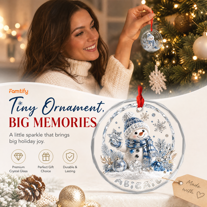 Personalized crystal snowman glass ornament in a cozy holiday setting