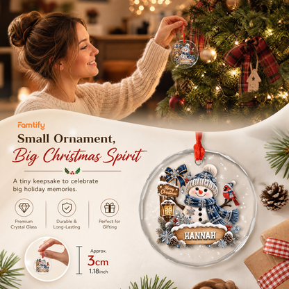 Personalized snowman cardinal glass ornament in a cozy holiday setting