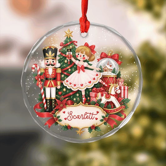 Round clear glass ornament with a ballerina, nutcracker, Christmas tree and a custom name plaque