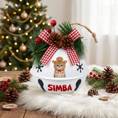 Custom photo gingerbread pet jingle bell ornament with pet photo and name on a festive table