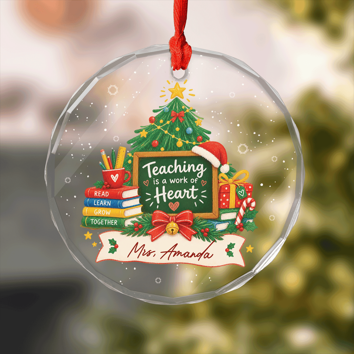 Round clear glass teacher ornament with a Teaching Is a Work of Heart chalkboard, books, Christmas tree and custom name