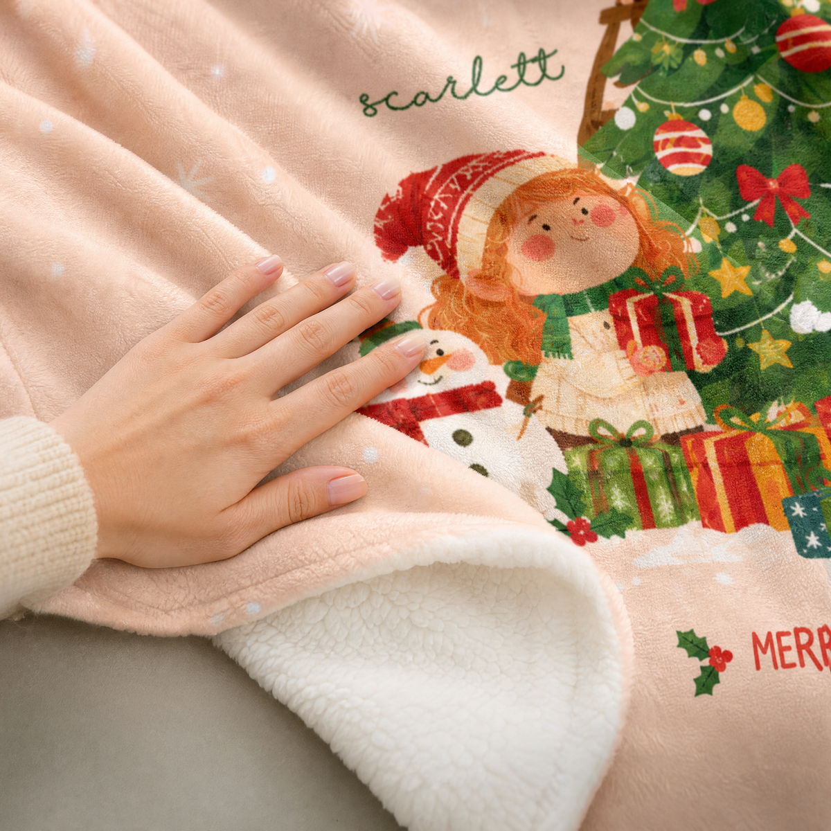 Close up of the plush print and sherpa lining of the Christmas hooded blanket