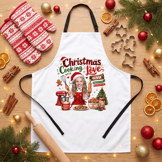 White Christmas Cooking With Love apron with custom photo face cook, mixer, tree and custom name, flat lay