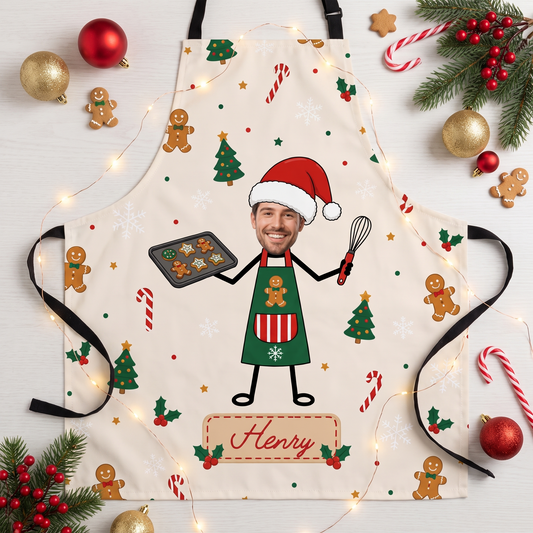 Cream gingerbread pattern apron with custom face baker holding cookie tray and whisk and name banner