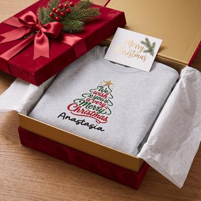 Heather grey Merry Christmas script tree name sweatshirt in a red gift box with a card