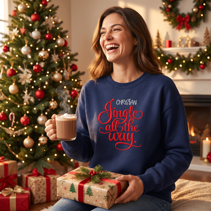 Laughing woman in a navy Jingle All the Way sweatshirt holding cocoa and a gift