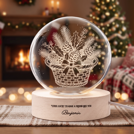 Crystal ball engraved with a woven basket of pinecones, pine and a bow on a wooden LED base with friendship message and custom name