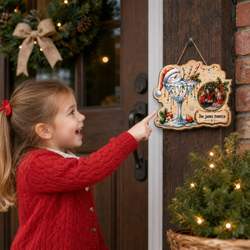 Shop custom Christmas wooden signs! Durable 0.5cm plywood cutout featuring a snowman in a cocktail glass, Christmas lights, custom family photo & personalized plaque!