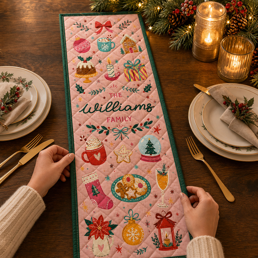 Hands placing a pink quilt runner with cocoa mugs, cookies, stocking, poinsettia and script custom family name