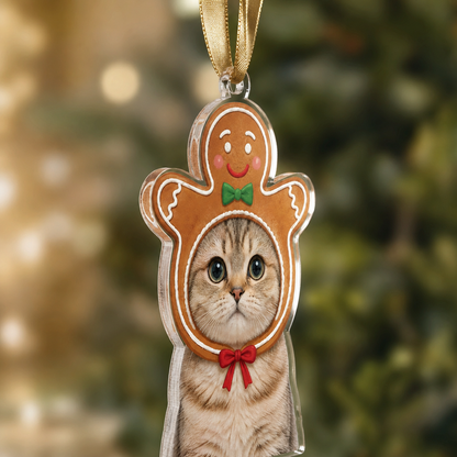 Side view of the clear acrylic gingerbread pet photo ornament on a gold ribbon