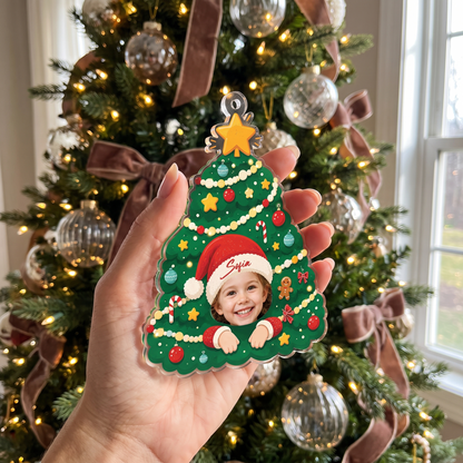 Hand holding the personalized Christmas tree face ornament with custom name