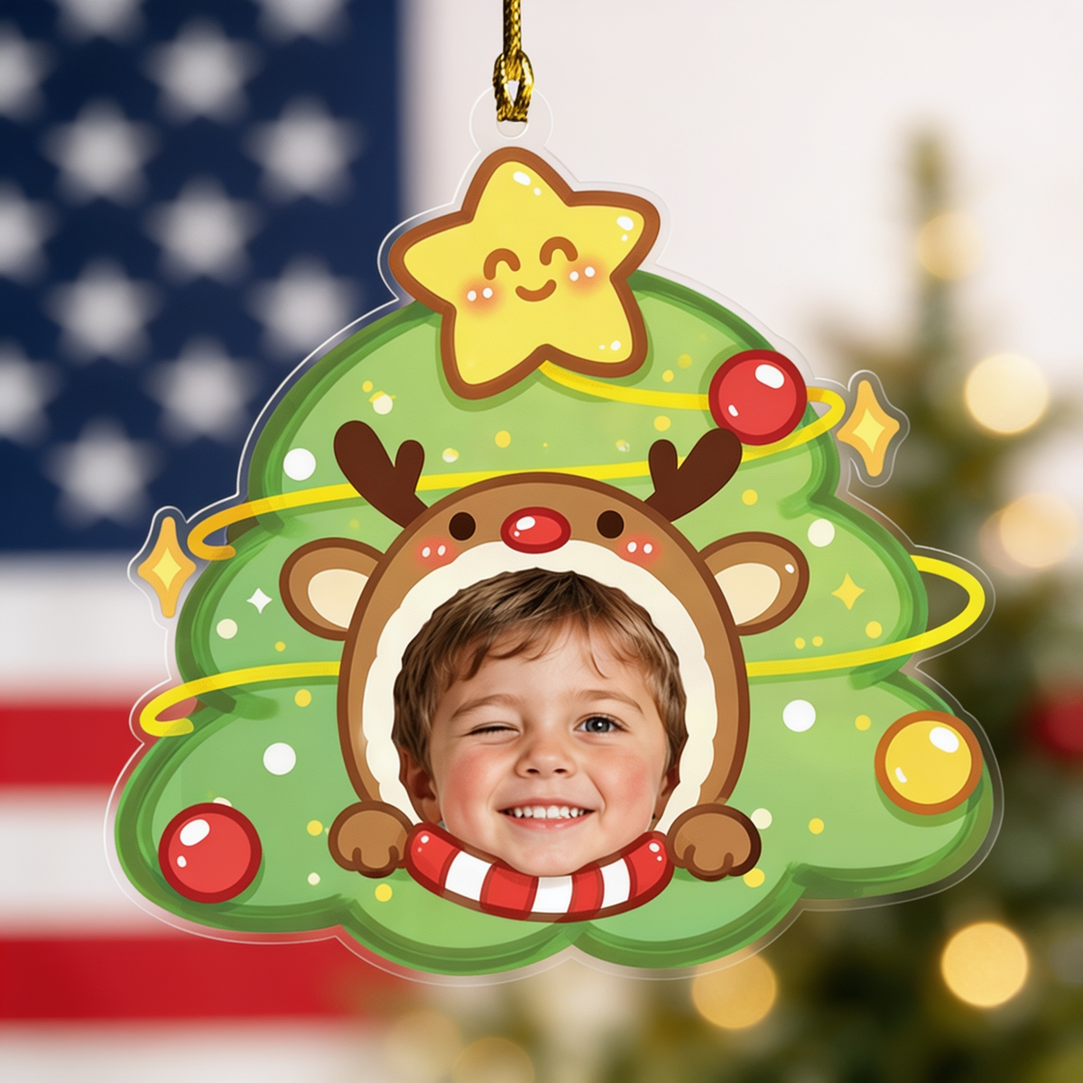 Kid face reindeer Christmas tree ornament in front of an American flag