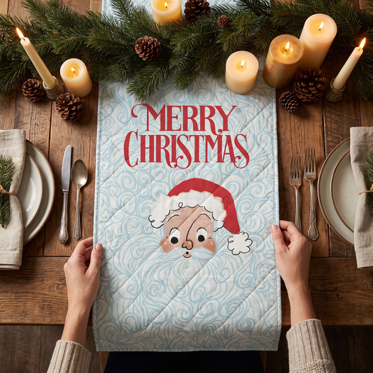 Hands laying an ice blue quilted table runner with Merry Christmas and long beard vintage Santa on a candlelit table