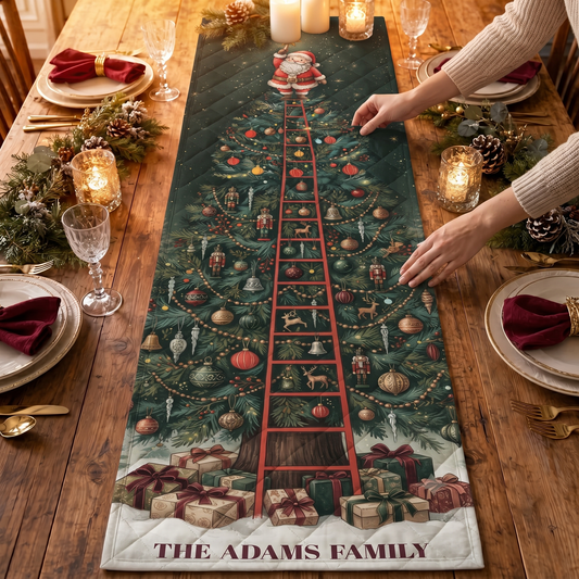 Hands placing a green quilt table runner with Santa on a red ladder atop a tall vintage Christmas tree and custom family name