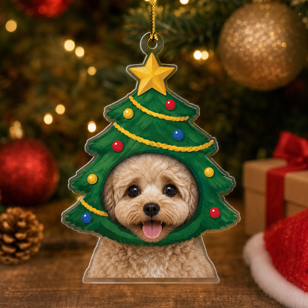 Christmas tree pet ornament with a fluffy dog photo beside pinecones and a Santa hat