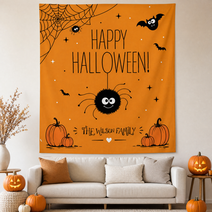 Orange Happy Halloween tapestry with a cute fuzzy spider, spider web, bats, pumpkins and a custom family name