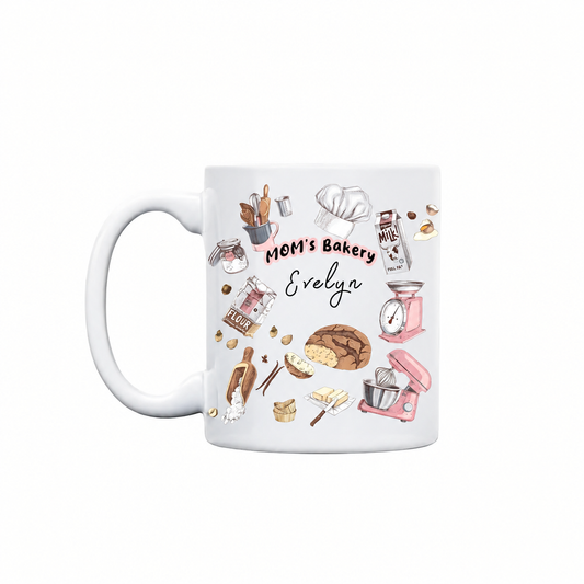 Personalized MOM's Bakery mug with bread loaf, pink stand mixer, flour and kitchen scale illustrations and custom name