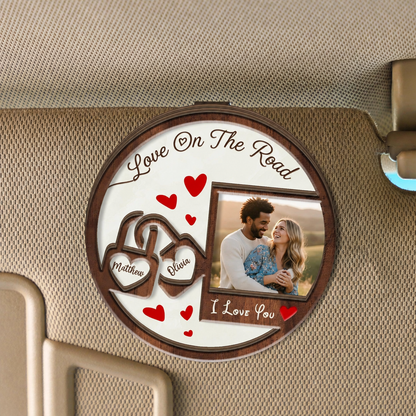 Round two layer wooden car visor clip reading Love On The Road with interlocking heart names, custom couple photo and I Love You