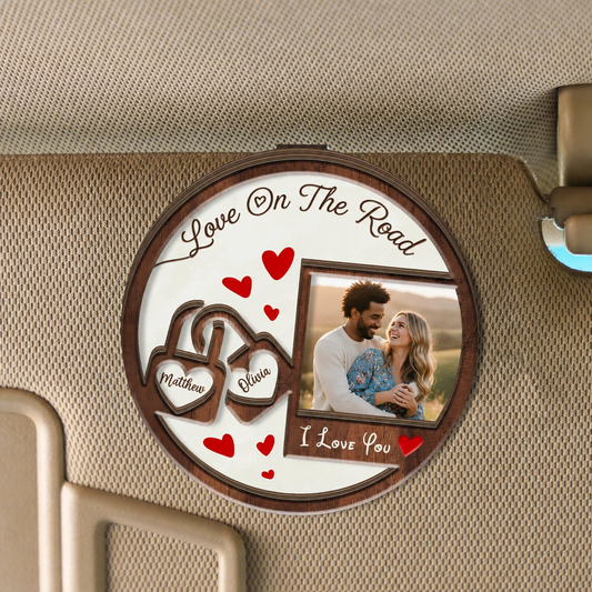 Round two layer wooden car visor clip reading Love On The Road with interlocking heart names, custom couple photo and I Love You