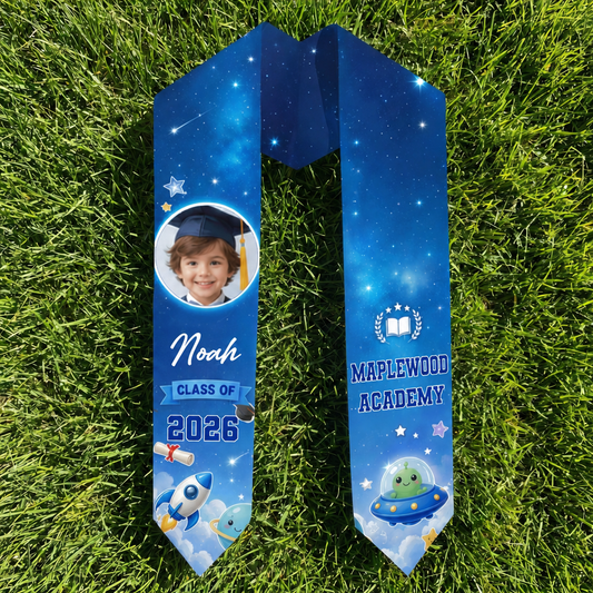 Blue galaxy rocket kid graduation stole with child photo, name Noah, Class of 2026 and Maplewood Academy on a hanger