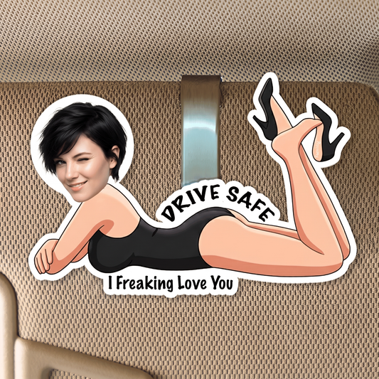 Acrylic car visor clip of a custom face cartoon woman in a black swimsuit reading Drive Safe I Freaking Love You