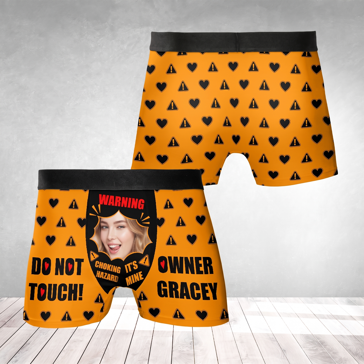Orange boxer briefs with black hearts and hazard icons, custom face photo, Choking Hazard and Owner custom name joke
