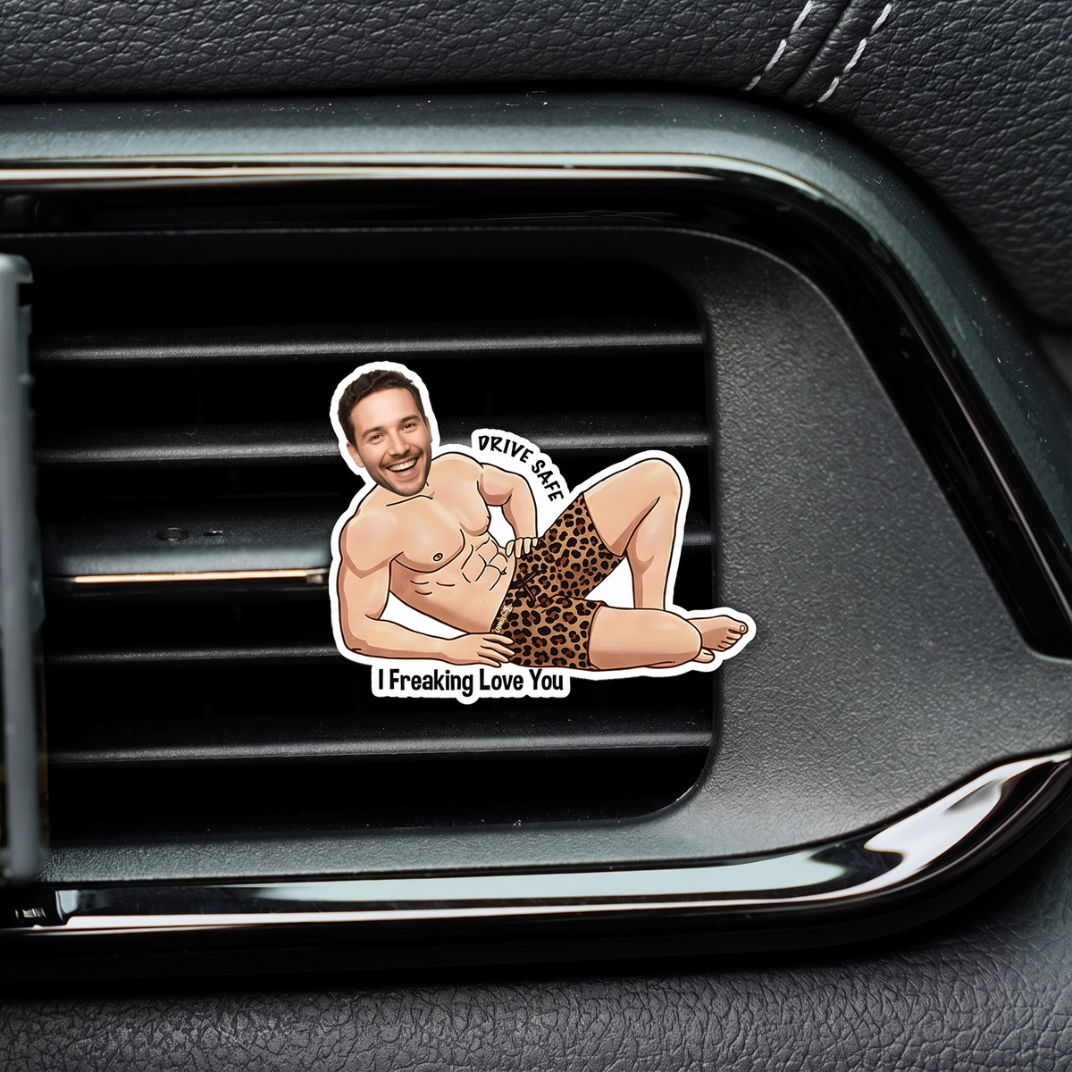 Custom face cartoon man in leopard shorts acrylic clip reading I Freaking Love You attached to a black car air vent